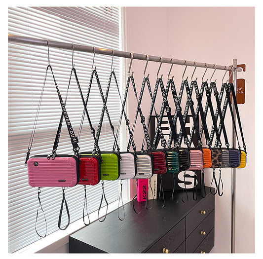 Mini valise forme sac à bandoulière